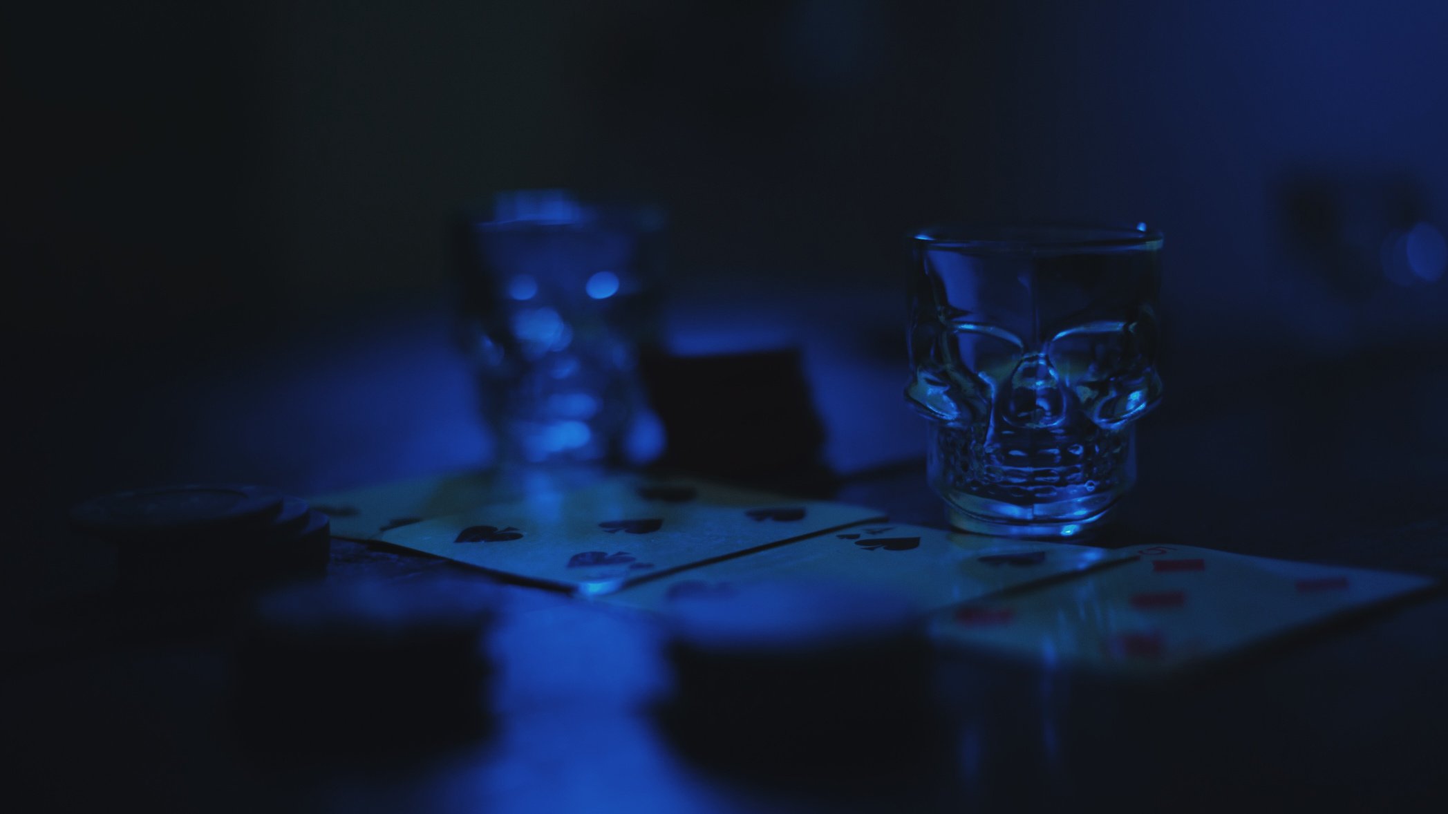 Skull Glasses on the Poker Table