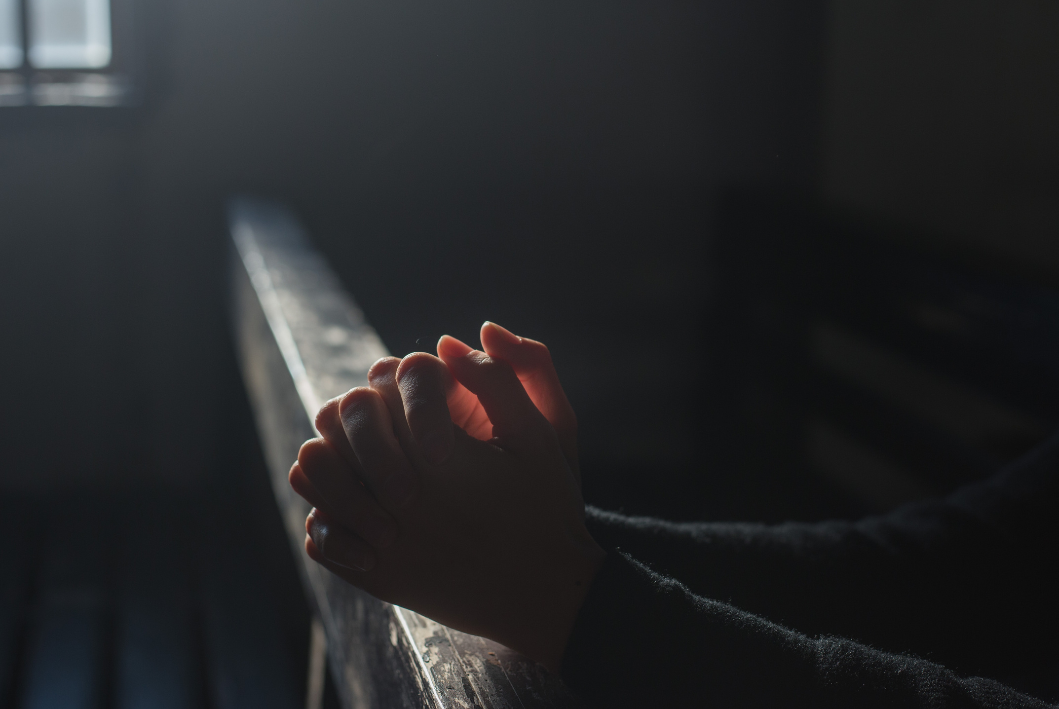 Person Praying in the Church